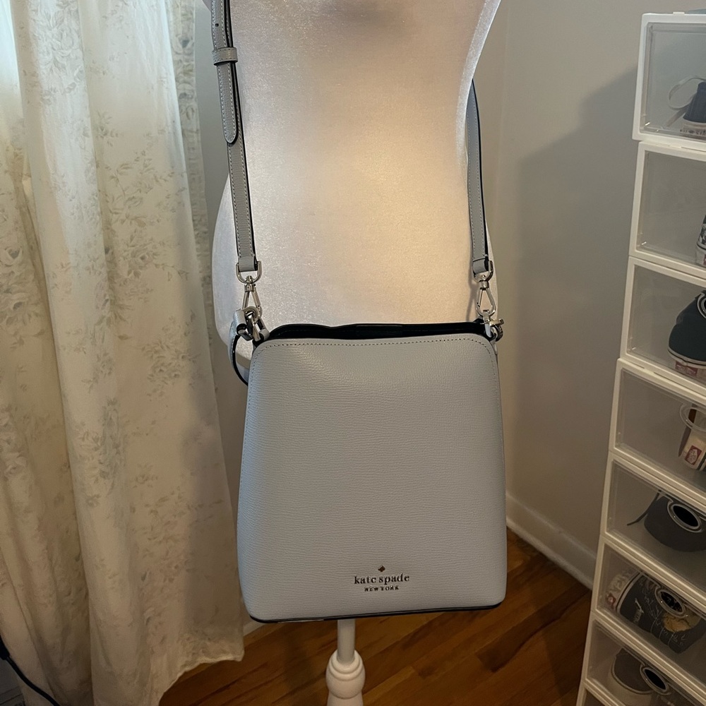 Light blue authentic Kate Spade cross body purse.